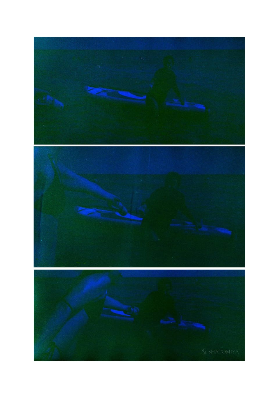Collage of three deeply burnt‑film photos in deep blue hues showing a girl out at sea with a paddle board, trying to reach for a refreshment offered by another girl standing at the shore.
